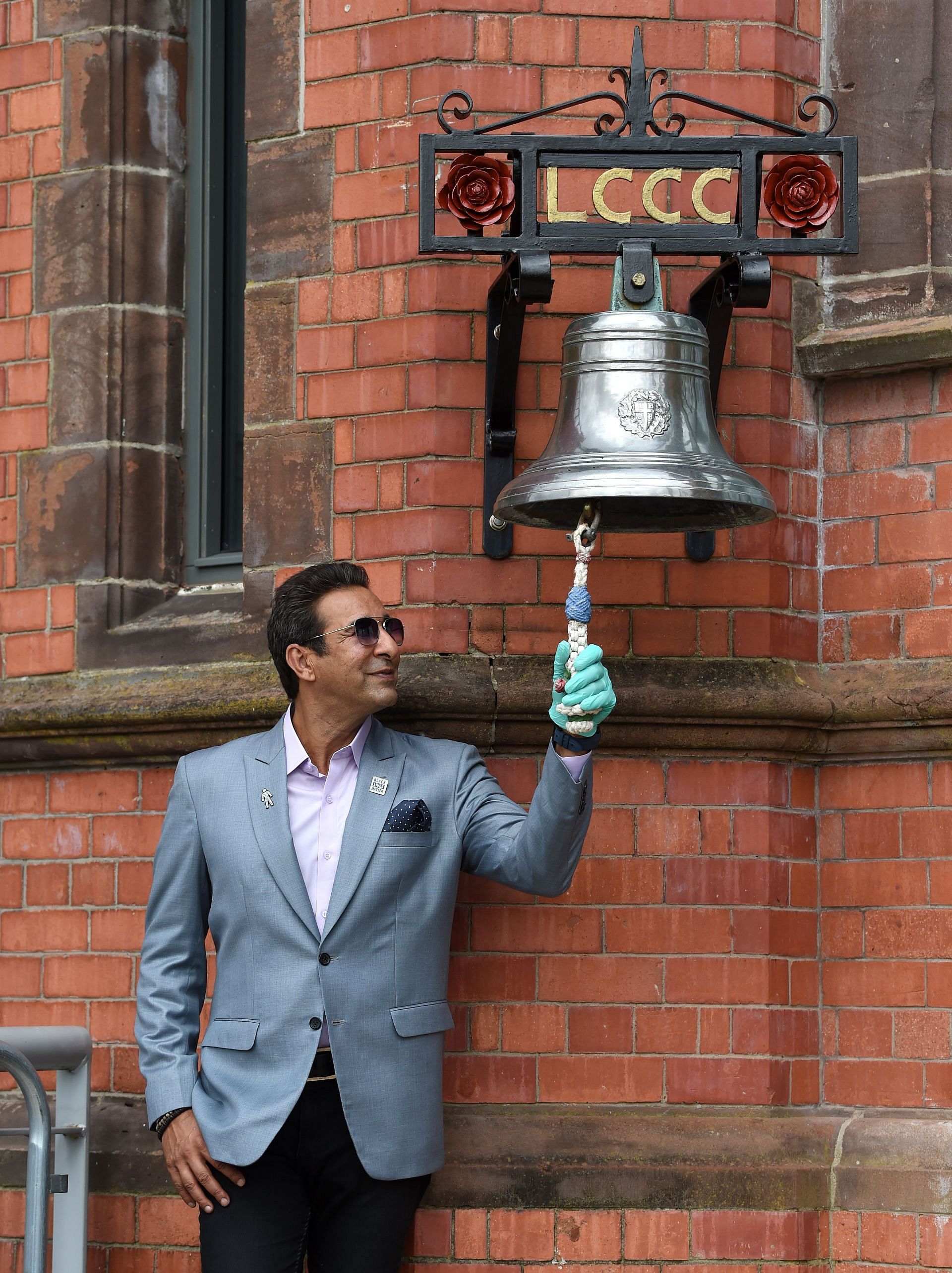 Former Pakistan captain and Sky Sports Broadcaster Wasim Akram rings the bell prior to Day Three of the 1st #RaiseTheBat Test Match between England and Pakistan at Emirates Old Trafford on August 07, 2020 in Manchester, England. (Photo by Gareth Copley/Getty Images for ECB)